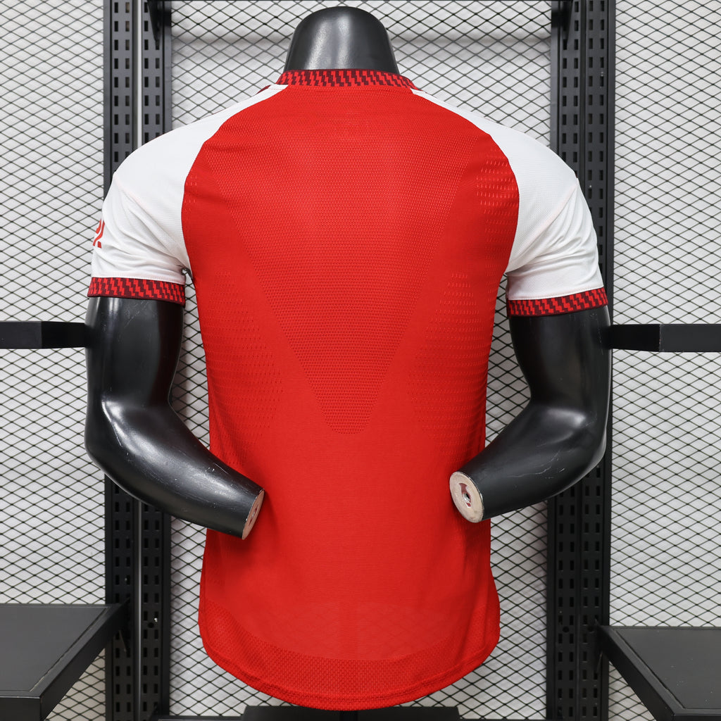 Arsenal home football jersey back view, red with white sleeves and red patterned trim