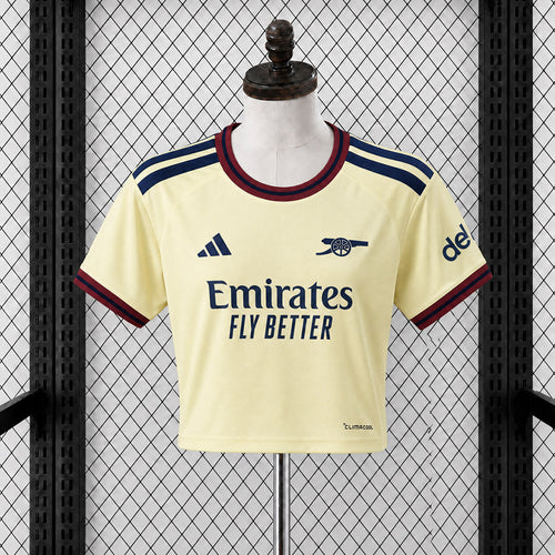 Women’s cropped football jersey in pale yellow with navy/red trim and front sponsor print