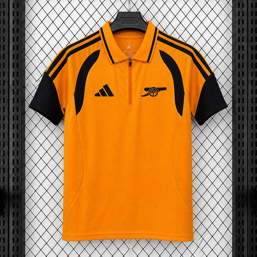 Arsenal orange travel polo shirt with black sleeves, striped shoulders and quarter-zip