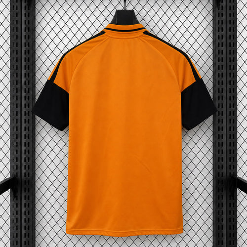 Arsenal orange travel polo shirt, black short sleeves, high collar, back view