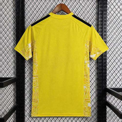 Aston Villa yellow goalkeeper fan jersey back view with black shoulder stripes