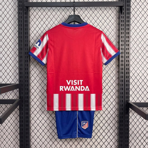 Kid home soccer kit, red back jersey with VISIT RWANDA text and blue shorts