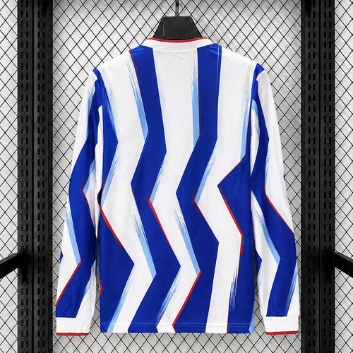Back view of Barcelona long-sleeve fan jersey, blue and white chevron stripes with red trim