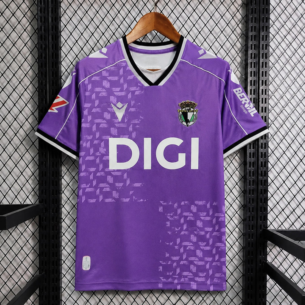 Purple football jersey, V-neck with crest and 'DIGI' sponsor, short sleeves.