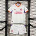 Kids away football kit: white jersey with purple sleeves, orange trim, PSV crest, matching shorts