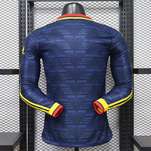 Dark blue away long-sleeve football shirt, back view with yellow-and-red collar trim