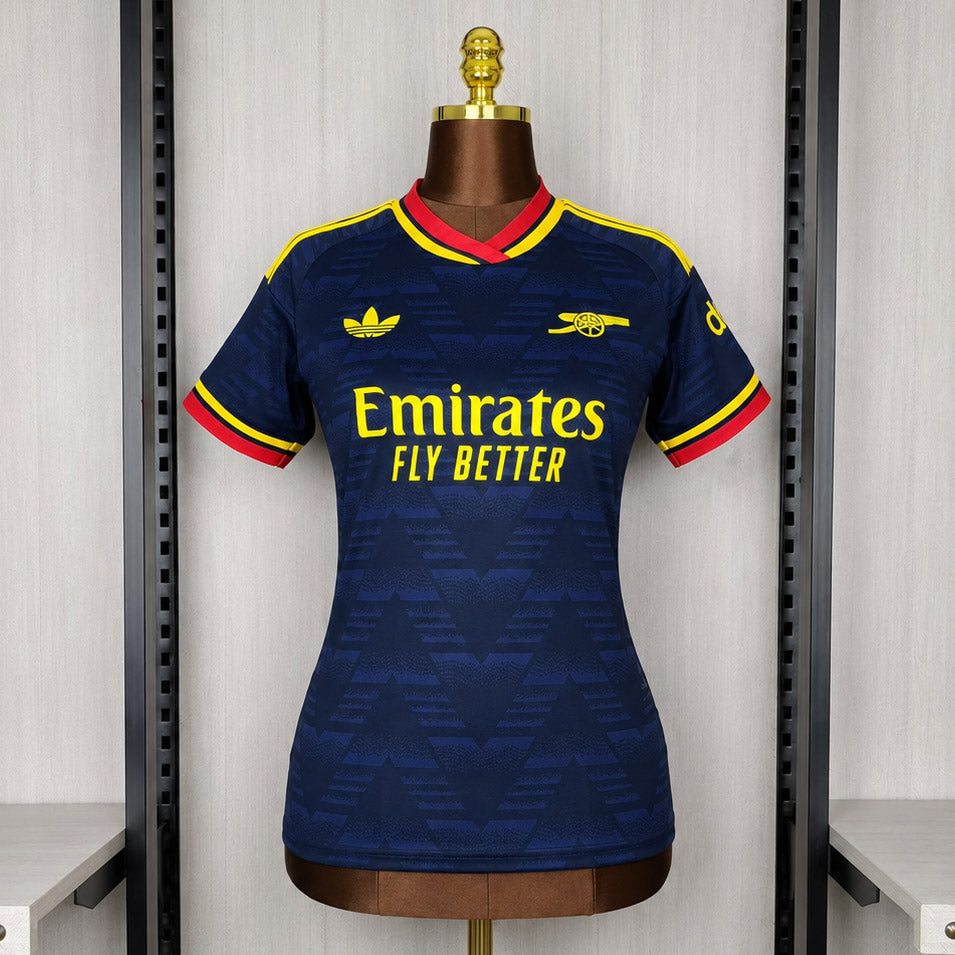 Women’s dark blue Arsenal away soccer jersey, yellow and red trim, Emirates sponsor