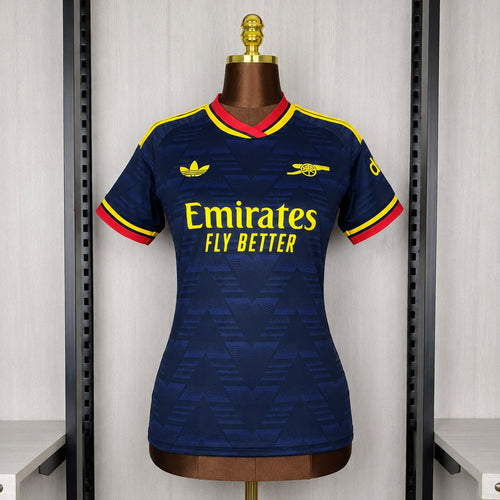 Women’s dark blue Arsenal away soccer jersey, yellow and red trim, Emirates sponsor