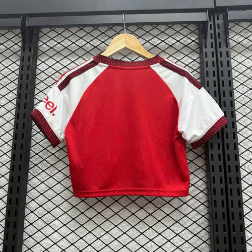Women’s cropped home football jersey, back in red with white sleeves and striped trim