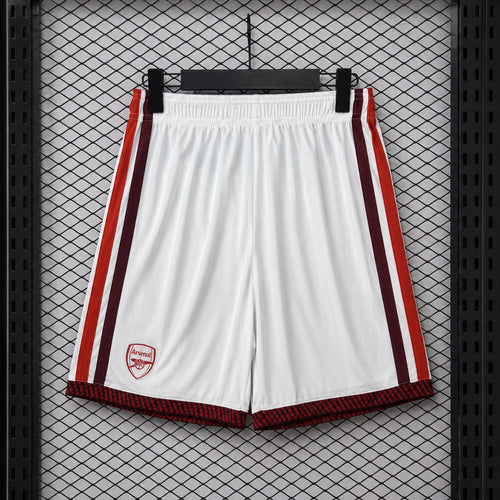 White fan shorts with red side stripes, Arsenal crest badge, elastic waistband