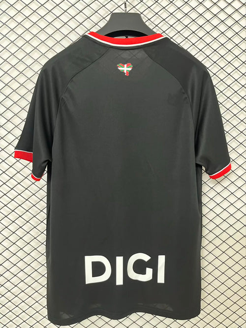 Black away fan jersey back with red collar trim and large DICI print