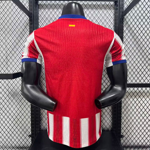 Atletico Madrid home football jersey back view, solid red with blue collar and sleeve cuffs.