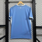 Manchester City home football jersey back in light blue with small "CITY" detail at neck