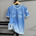 Manchester City home football jersey front in light blue with crest and Puma branding