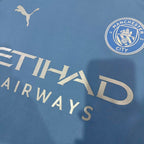 Light blue Manchester City jersey close-up with "ETIHAD AIRWAYS" sponsor and Puma logo
