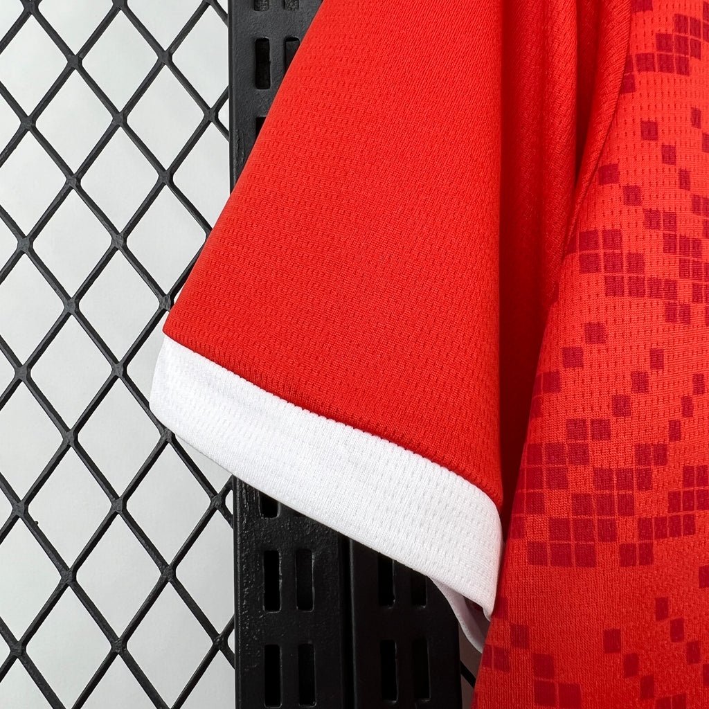 Red jersey sleeve with white ribbed trim at cuff