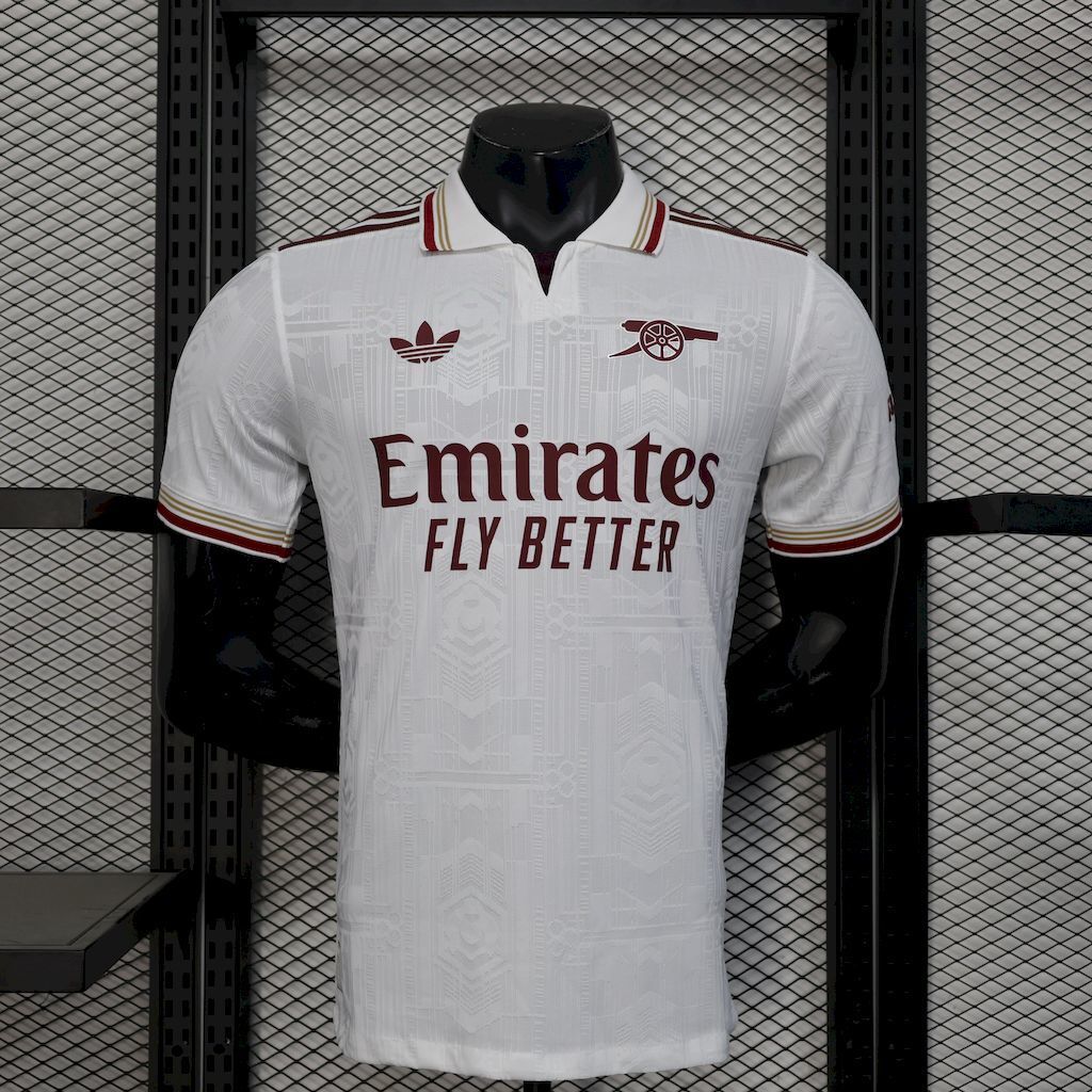 White football shirt with maroon and gold collar trim, Emirates Fly Better sponsor