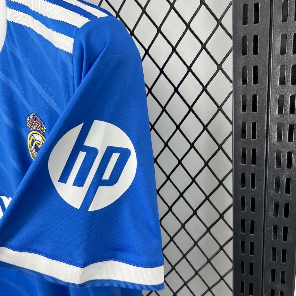 Real Madrid jersey sleeve with HP logo and white striped cuff trim