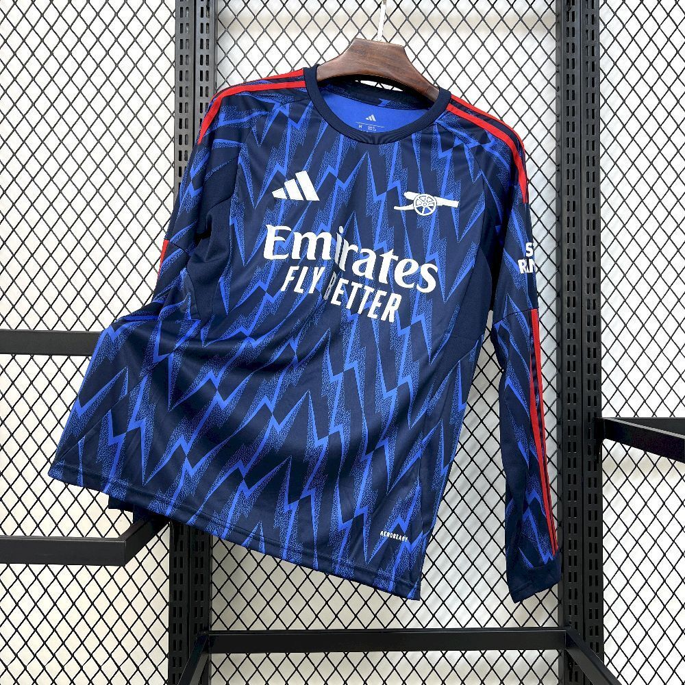 Blue Arsenal away long-sleeve fan jersey with zigzag pattern and Emirates Fly Better print