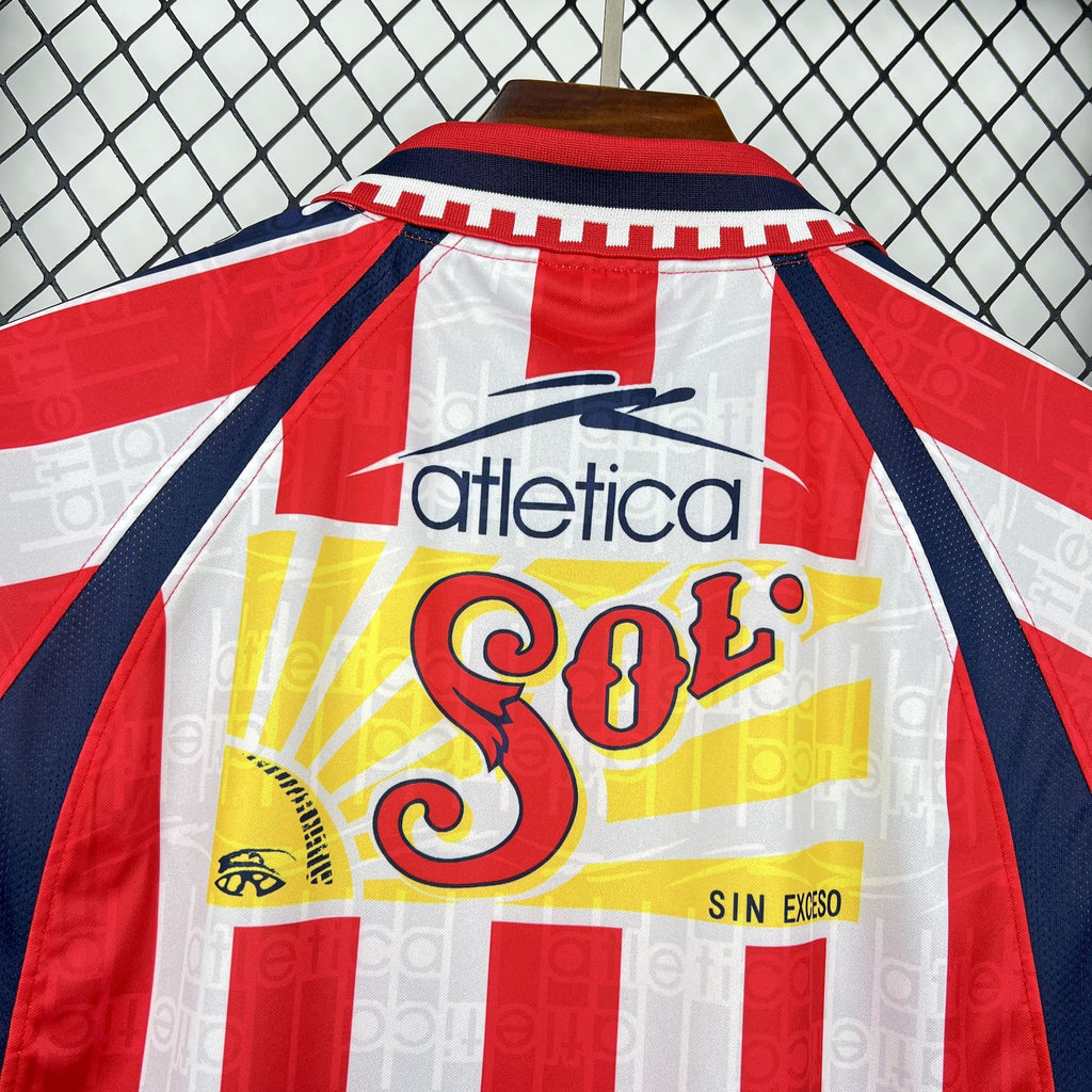 Retro home soccer jersey back close-up with red collar and yellow So Coca-Cola print