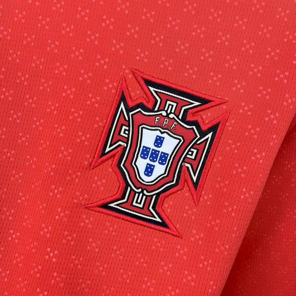 Red long-sleeve football jersey with Portugal crest emblem