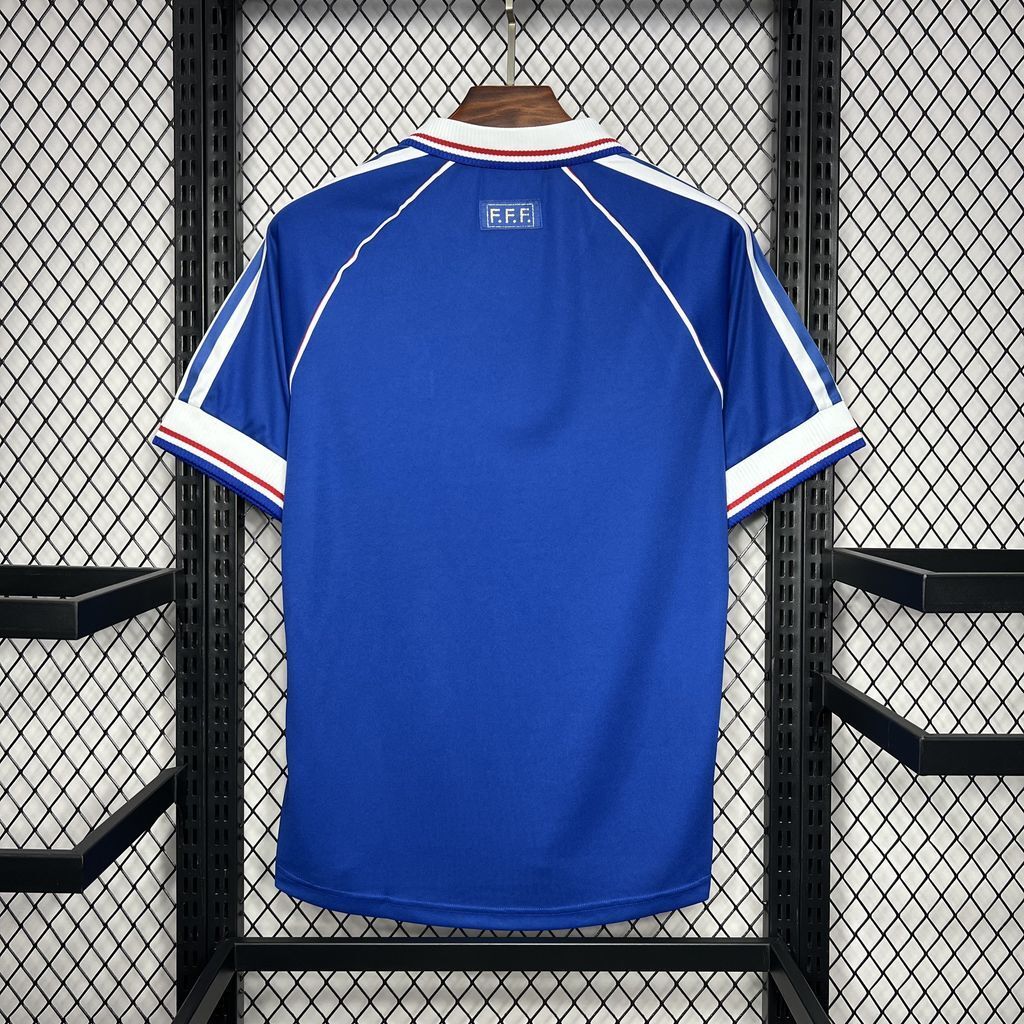 Blue France retro football jersey, back view with white-red trim at collar and sleeves.
