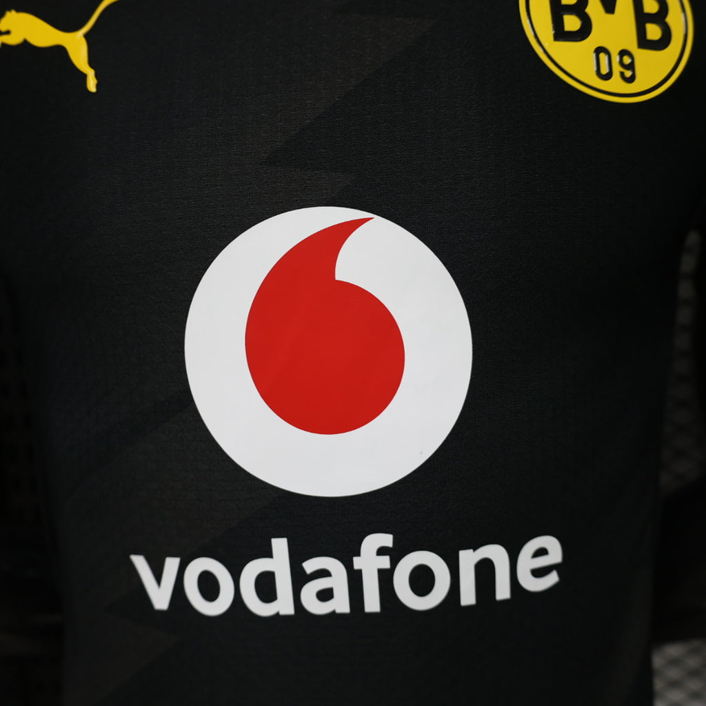 Black football jersey with Vodafone sponsor and red-white O logo detail