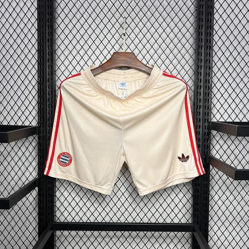 White football fan shorts with red side stripes and crest