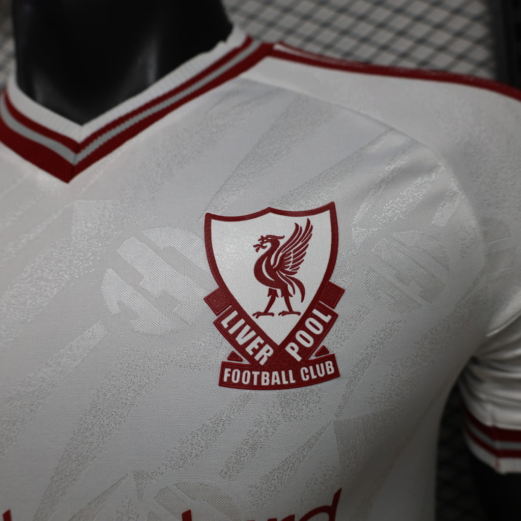 Liverpool FC crest on white jersey back with textured pattern