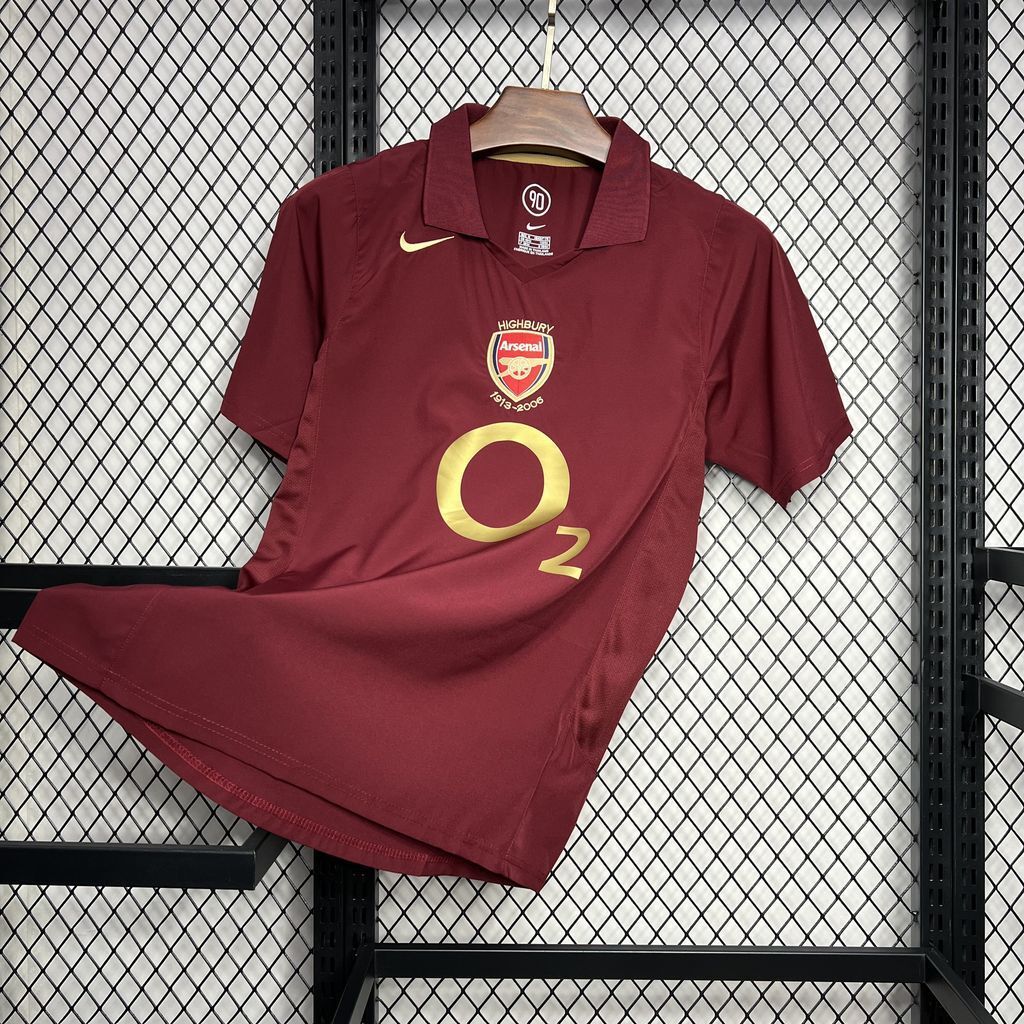 Maroon football jersey with crest, Nike swoosh, and gold O2 emblem