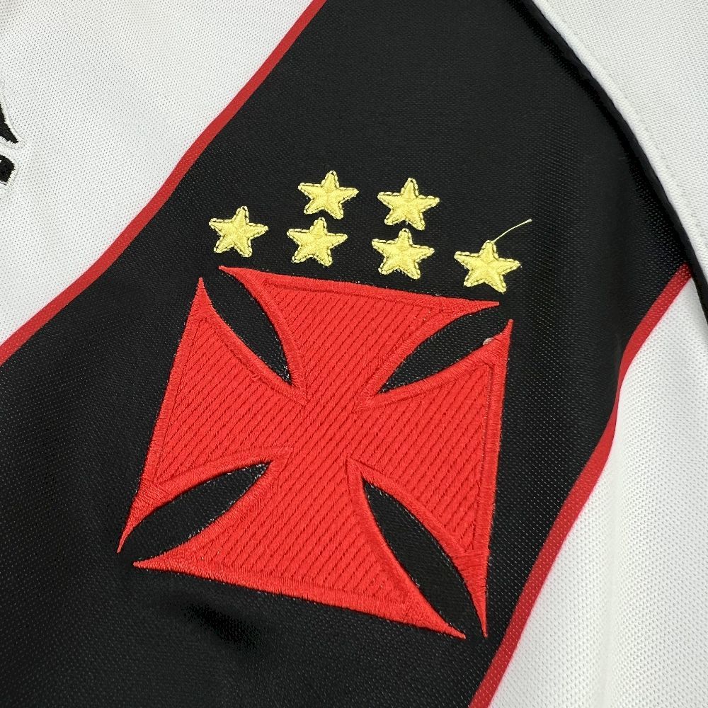Retro football jersey crest close-up with red star emblem on black panel