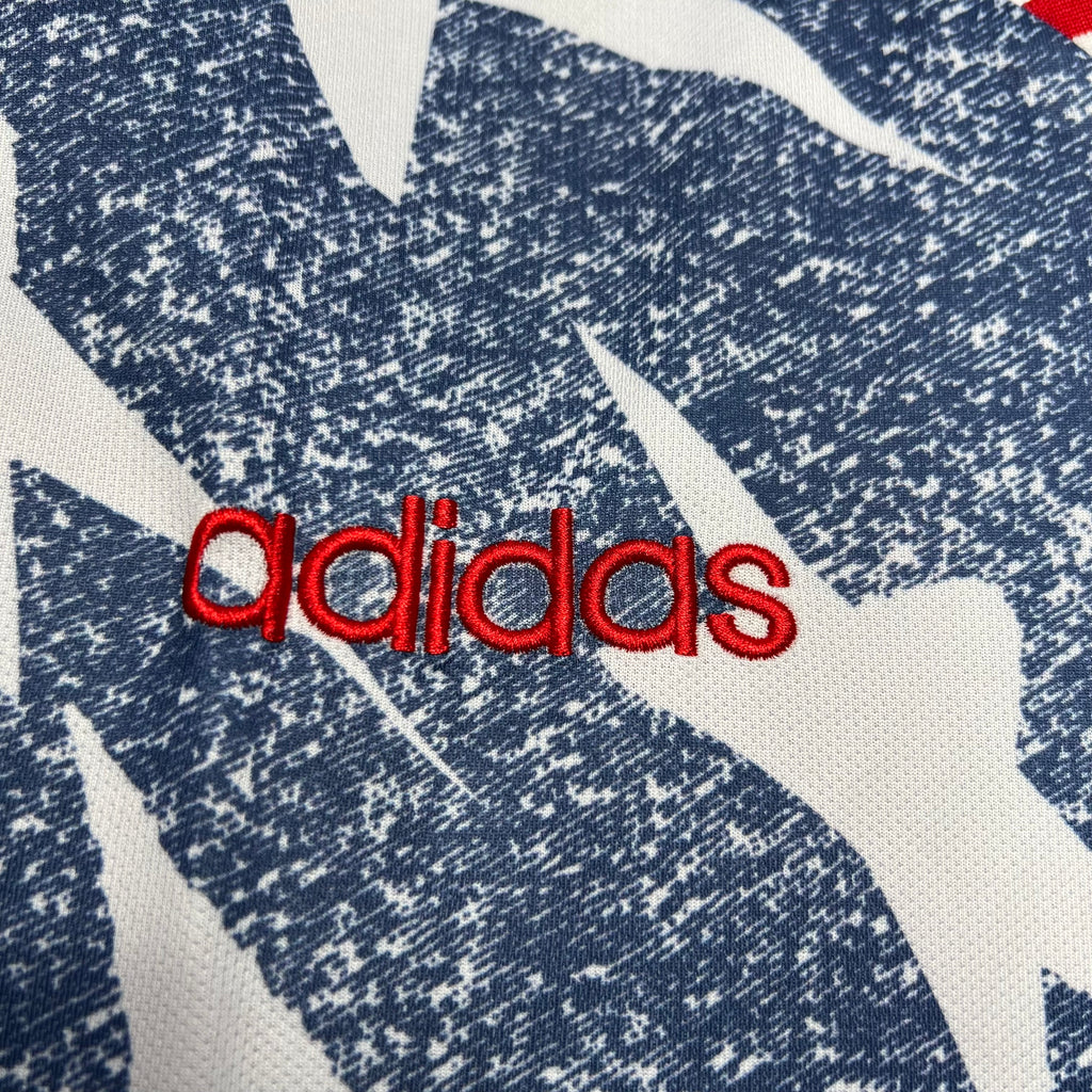 adidas logo on USA 1994 away jersey in blue and white star pattern