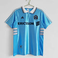 Sky blue away soccer jersey with ERICSSON sponsor, adidas logo, and Marseille crest