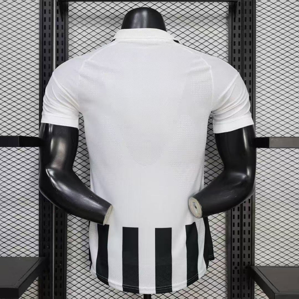 Juventus home soccer jersey back view in white with black vertical stripe panels