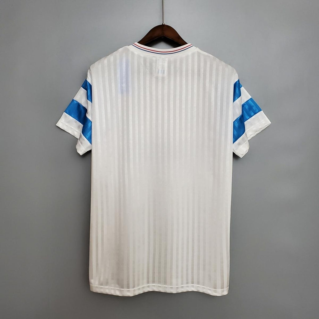 Home soccer jersey, white with blue sleeve stripes and V-neck collar, back view