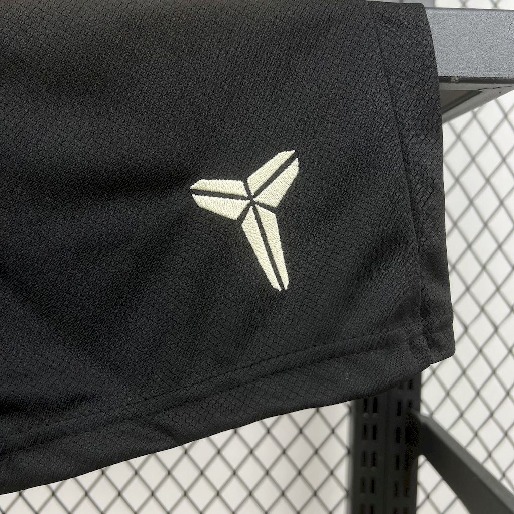 Black kid football shorts with white brand logo print
