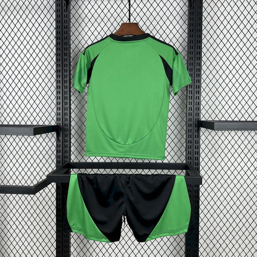 Kids green soccer jersey and black shorts set, back view with team trim
