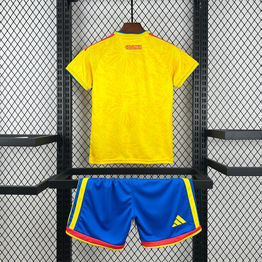 Kid Colombia home soccer kit: yellow back jersey with blue striped shorts and red hem