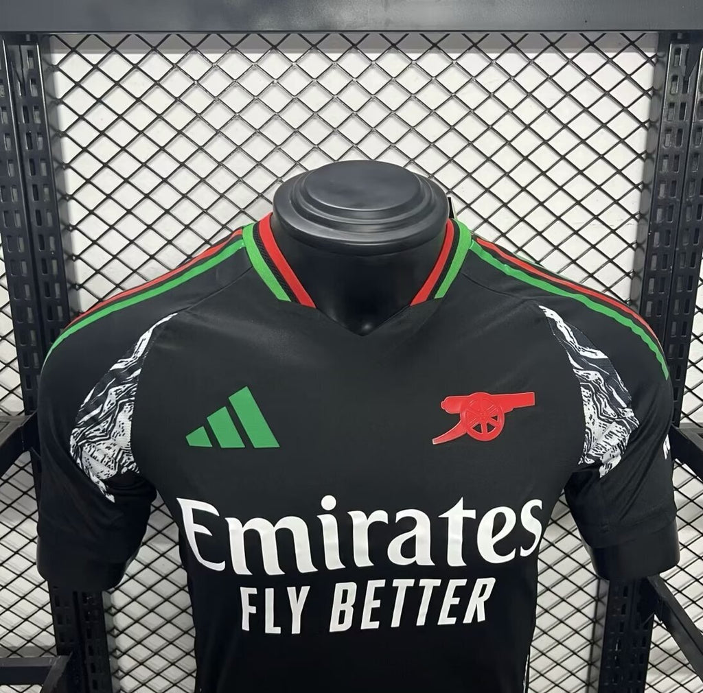 Arsenal away football jersey front, black with adidas stripes, Emirates text, red crest