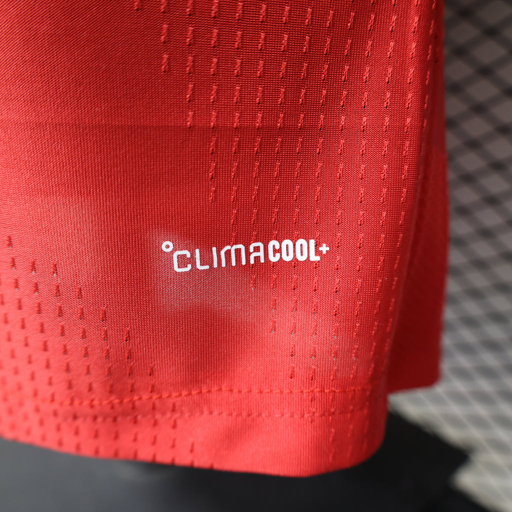 Red football shirt hem detail with climacool ventilation logo
