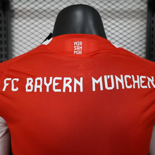Red Bayern Munich home long-sleeve jersey back; large FC Bayern text and neck graphic.