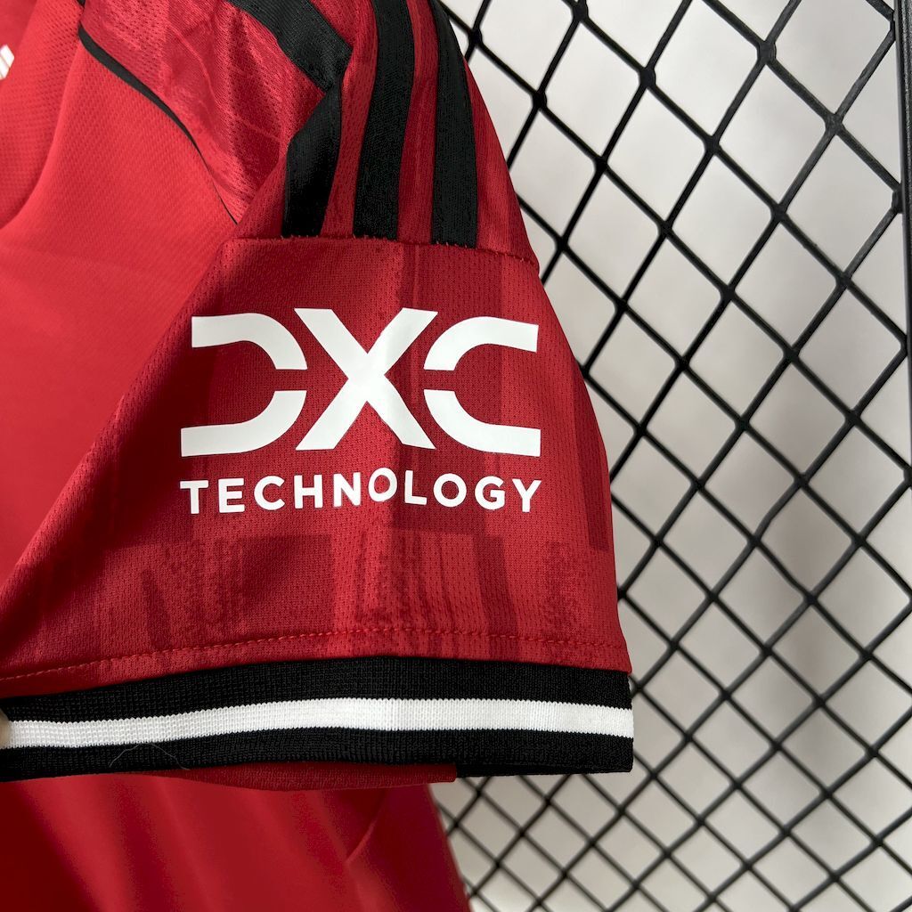 Kids red football shirt sleeve showing 3Xc Technology sponsor print