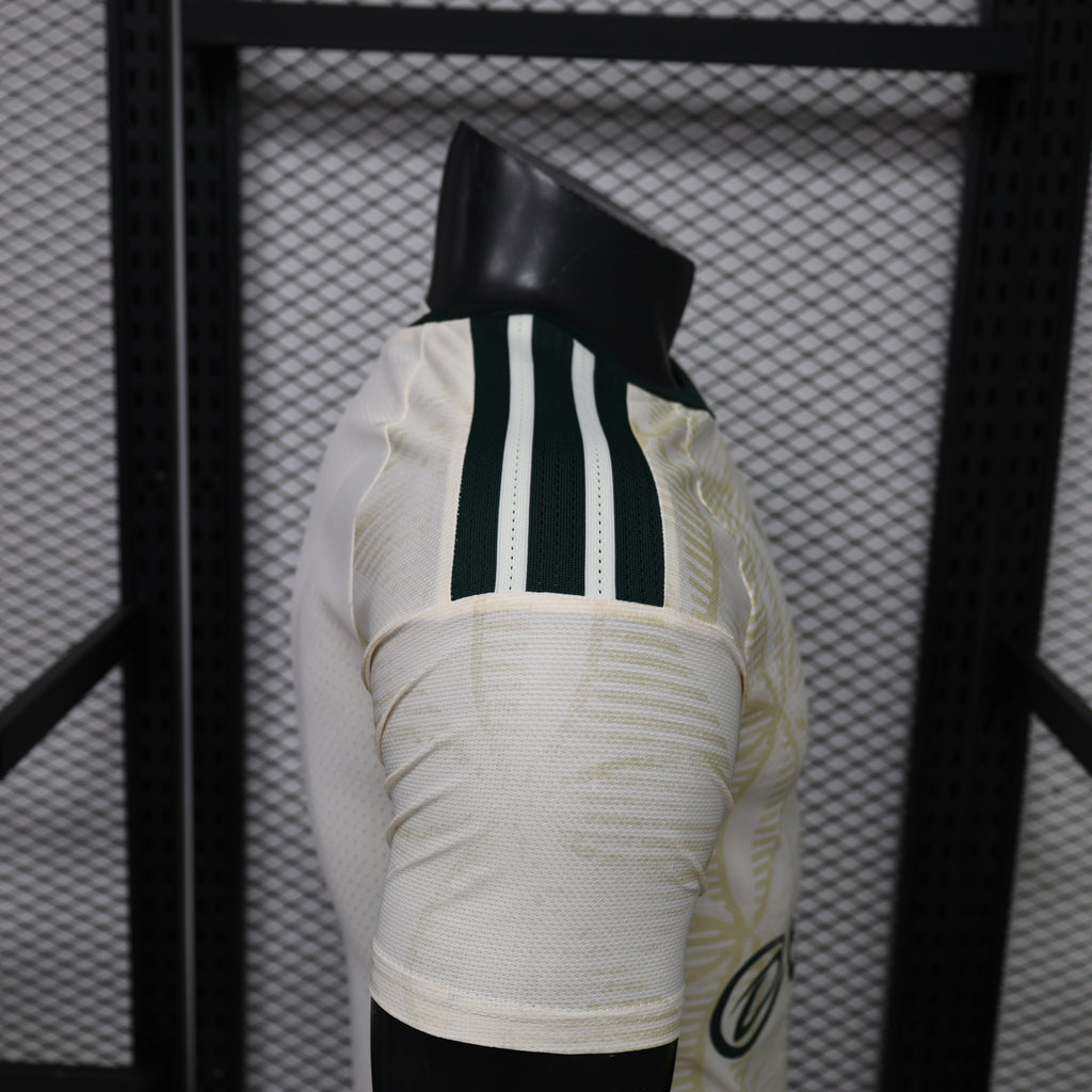 Light yellow football jersey back with black adidas stripes and club crest