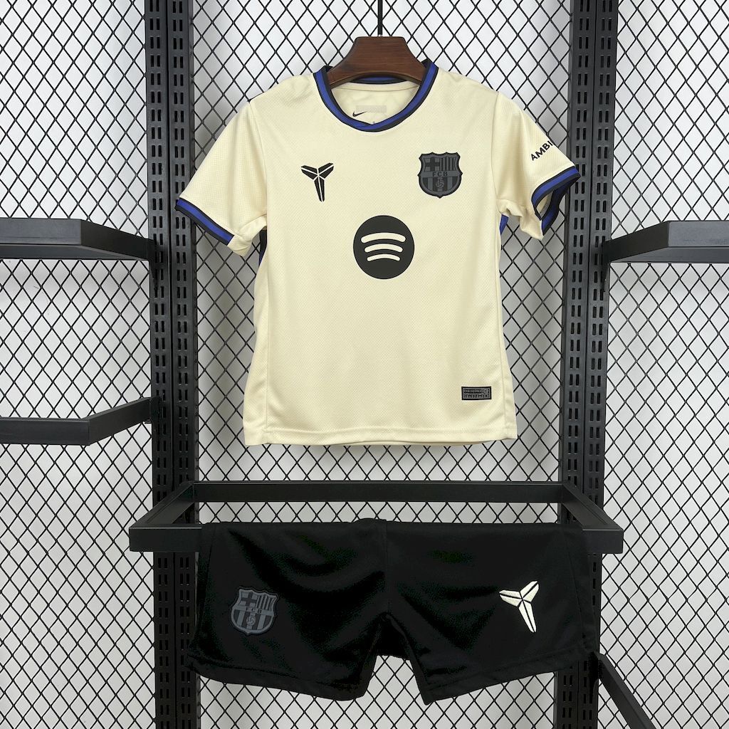 Kid away football kit: cream jersey with blue trim and black shorts