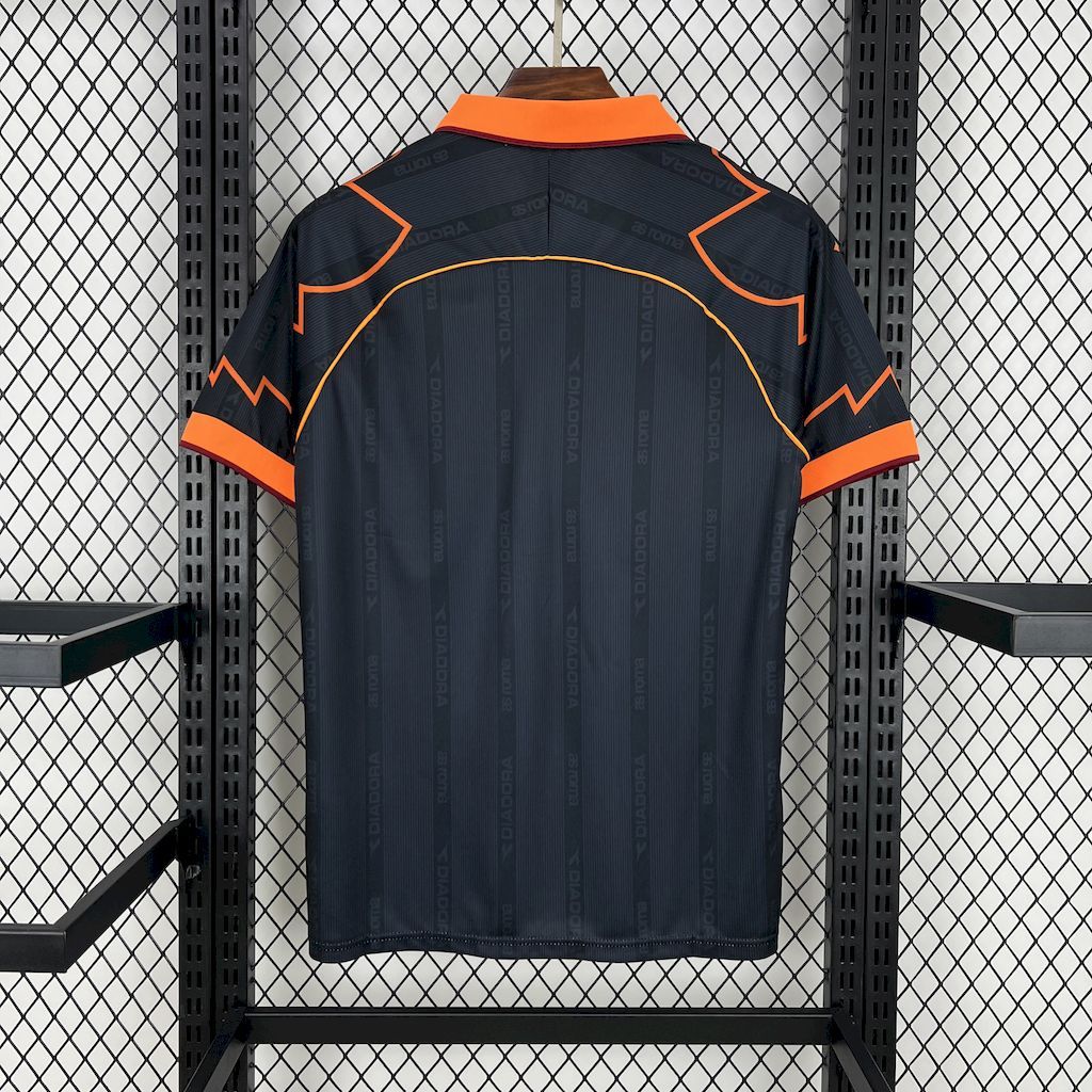 Retro football jersey, back view in dark navy with orange collar and side piping
