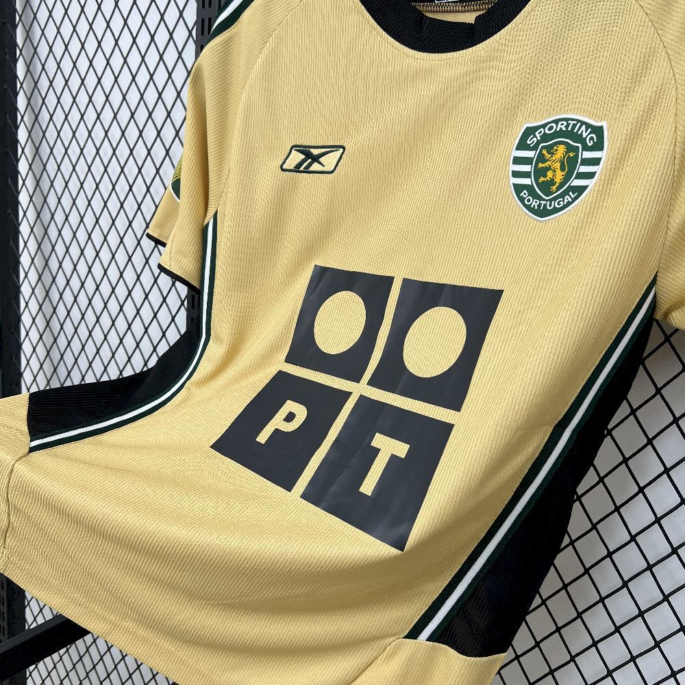 Yellow retro football jersey front with black geometric squares logo and club crest