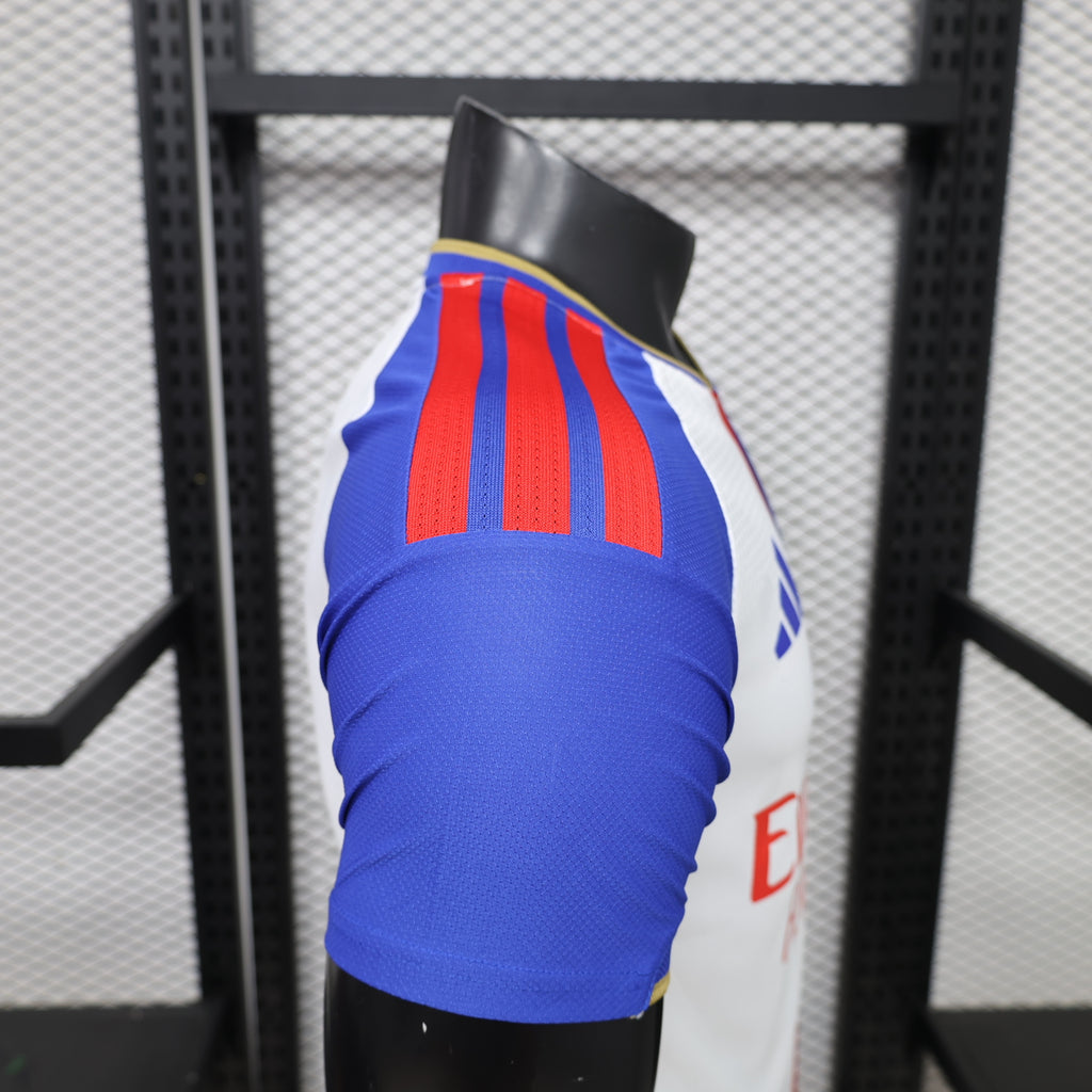 Home football shirt sleeve detail, blue with red stripes and yellow collar trim