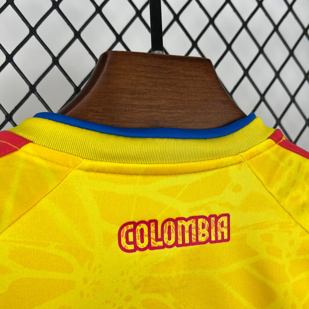 Yellow jersey collar close-up with COLOMBIA text and red trim