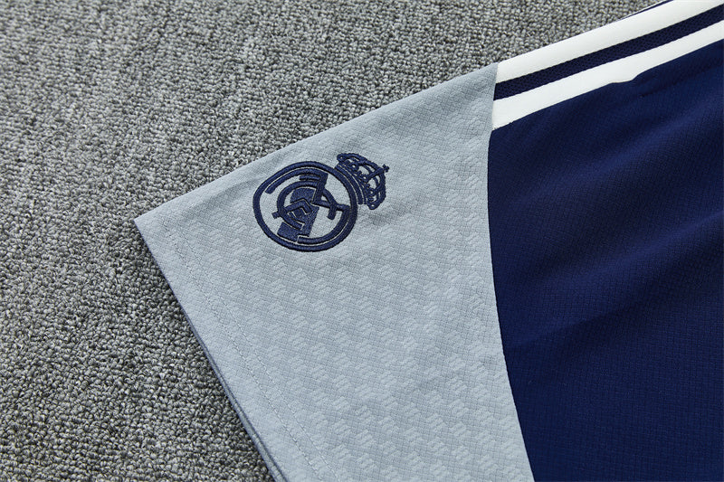 Light-blue shorts panel with Real Madrid crest emblem and white trim