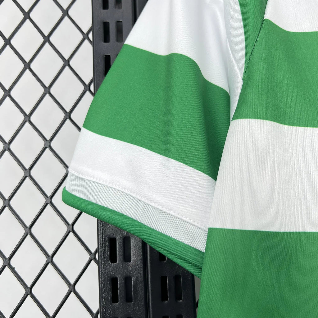 Green and white striped football shirt sleeve with ribbed cuff and seam stitching